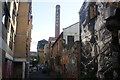 View of the Truman Brewery chimney from the back alley between Pedley and Buxton Streets