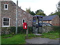 Elizabeth II postbox and telephone box on Cowling Road, Burrill