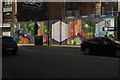 TQ3182 : View of a mural on a construction hoarding on Clerkenwell Road by Robert Lamb