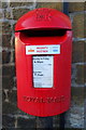 SE4882 : Elizabeth II postbox on the A170, Sutton-Under-Whitestonecliffe by JThomas