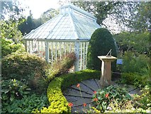 NX6851 : Greenhouse and sundial in Broughton House Garden by Oliver Dixon