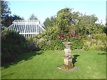 NX6851 : Greenhouse and sundial in Broughton House Garden by Oliver Dixon