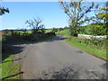 Minor road and bridge crossing a former railway line