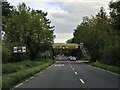 Evesham Road runs under a railway bridge