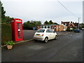 TF8930 : Sculthorpe Village Hall and telephone box by JThomas