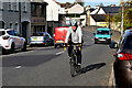 A cyclist passes by, Drumquin