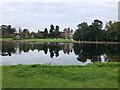 View across lake to Capesthorne Hall