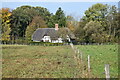 Footpath toward thatched cottage at Bourton Green