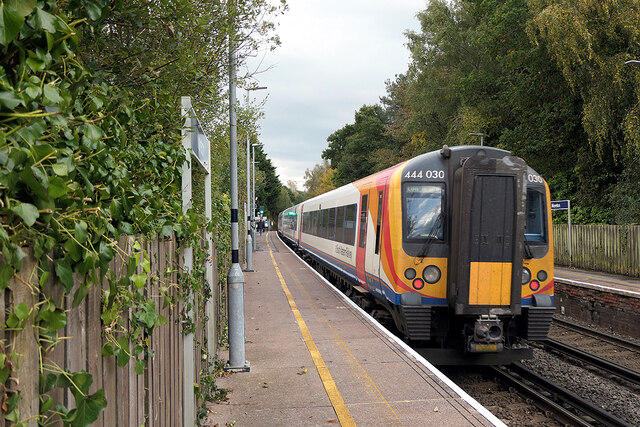 A train for Waterloo departing from Moreton station