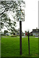 TL8654 : Lawshall village sign and bungalows on Hall Mead by Adrian S Pye