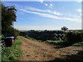 Farm track and bales near Great Cransley