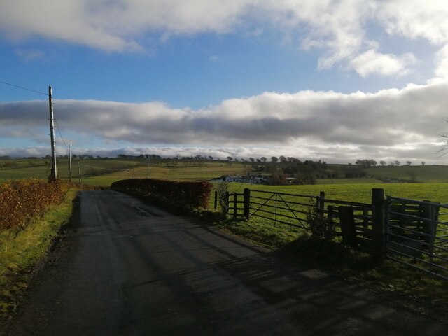 Farmland and minor road near West Drumloch