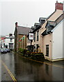 SO2118 : Rainy view of the Dragon Inn, High Street, Crickhowell by Jaggery