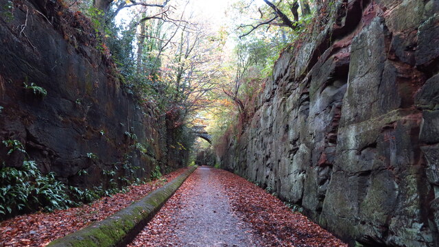 Wirral Way running through rock canyon, east of Neston