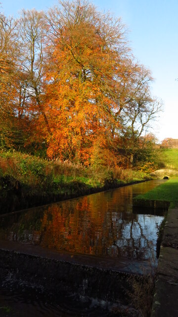 Leat & autumn colours below dam at Rudyard Reservoir, Staffordshire