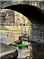 Kayaking under a bridge