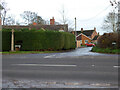 SO8441 : Road junction and cross at Hanley Castle by Chris Allen