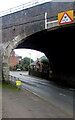 Headroom warning sign on Stonehouse High Street railway bridge 