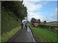 Walkers passing a farm at Adstone