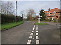 TG3227 : Village road junction by David Pashley