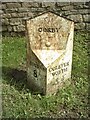 Old Milestone, on the A151, N side of The Green