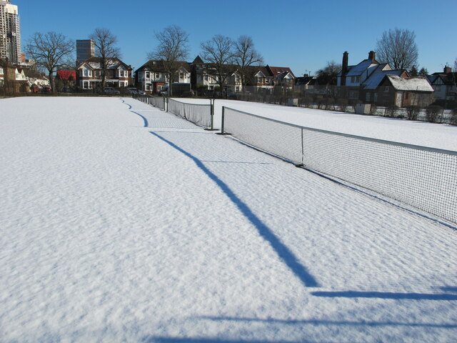 Shadow of tennis net on fresh snow