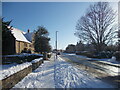 TF1505 : High Street, Glinton, in the snow by Paul Bryan