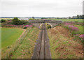 NH7751 : Railway line, by Inverness Airport by Craig Wallace