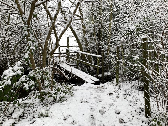 Snowy path and footbridge