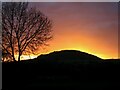SO4795 : Sunset behind Caer Caradoc, seen from Cardington by Pete Walker