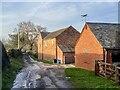 Farm buildings in mellow red brick