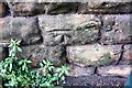 Benchmark on wall on SW side of Mount Hooton Road at Waterloo Road junction