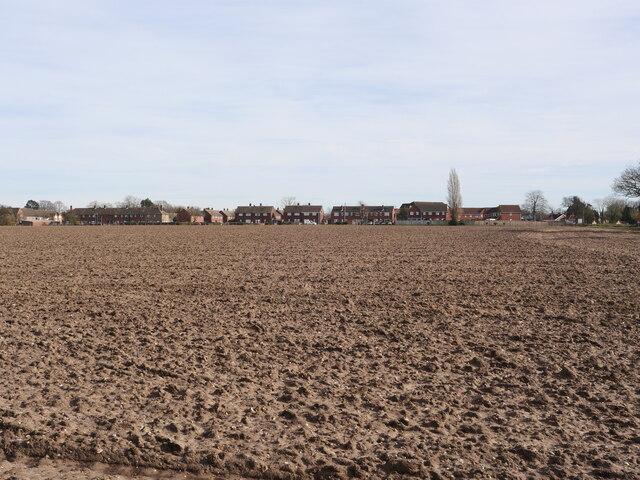 Ploughed Field with Housing Estate behind
