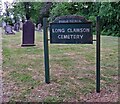 Cemetery sign and gravestones