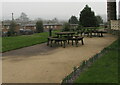 Wooden tables and benches outside Malpas Court, Newport