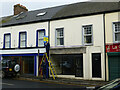 Replacing a sign along Lower Market Street, Omagh