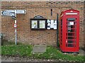 Signpost and telephone box