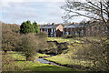 Terraced housing beyond River Deerness