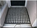 SH5771 : A tiled shop doorway on the High Street, Bangor by Meirion