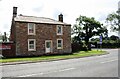 NY3451 : House on SE side of A595 at road junction at Cardewlees by Roger Templeman
