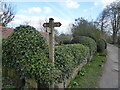 Shropshire Way fingerpost and waymarker discs on Grinshill