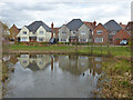 Houses overlooking Attenuation Pond, Kilnwood Vale