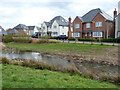 Houses overlooking Attenuation Pond, Kilnwood Vale