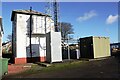 Signal box and comms mast beside railway west of Annan Station