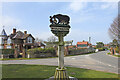 TF6628 : Wolferton village sign by Adrian S Pye