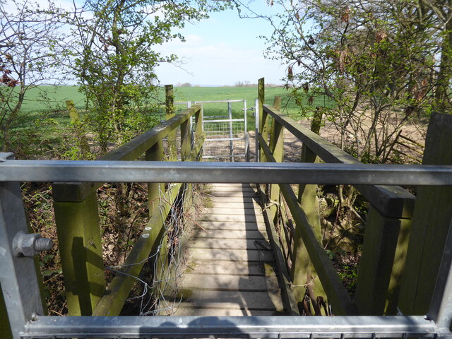 Metal footbridge at the field boundary