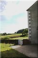 View past house at Hydepark Farm of grass fields