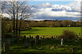 TM3865 : View north out of Kelsale churchyard by Christopher Hilton