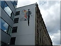 View of a mural on the side of Paul Street Studios from Paul Street