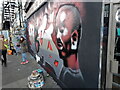 View of street art on the front of Kinkao Thai Restaurant on Brick Lane